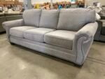 ASHLEY FURNITURE Stone Grey Suede-Like Roll Arm Sofa with Nailhead Trim - Image 5